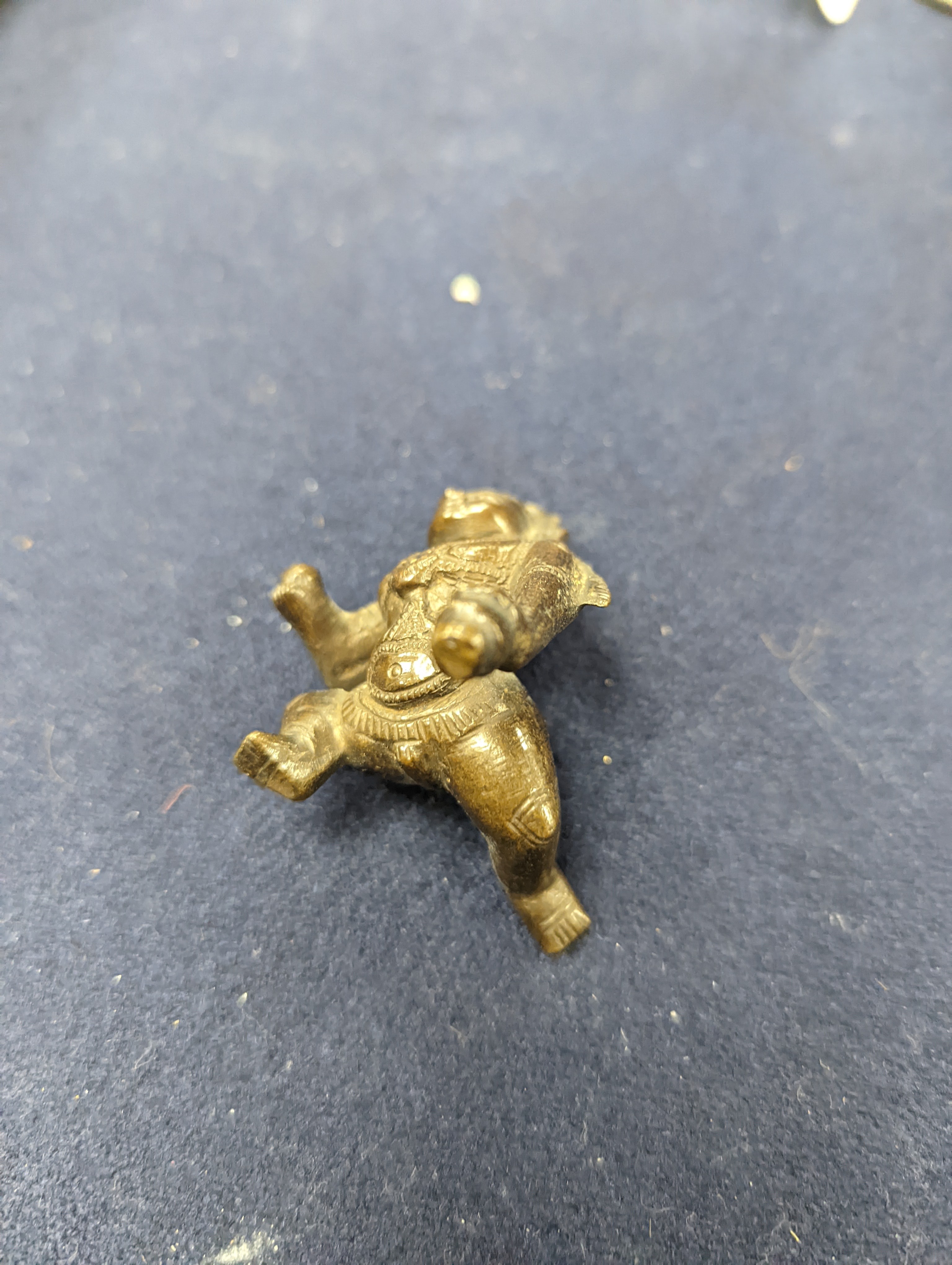 A Chinese gilt copper figure, a Chinese Dog of Fo, a bell, a censer, six Indian bronze figures and a scroll box